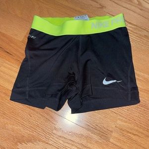 Black and neon yellow Nike pros